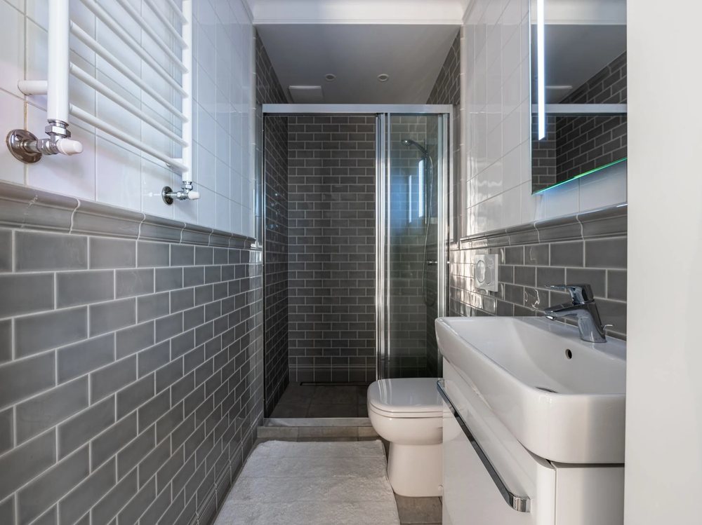 A compact tiled shower room